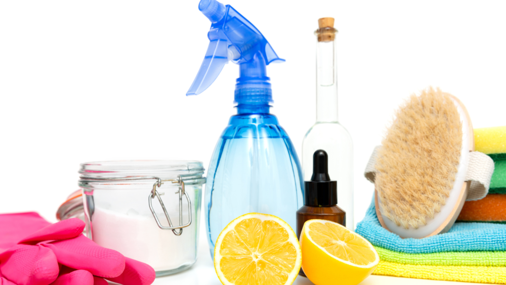 A collection of cleaning supplies and natural products commonly used for household cleaning tasks.