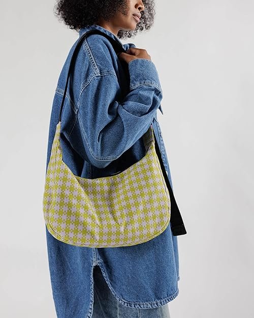 A woman wearing baggu medium nylon bag that is stylish and sustainable