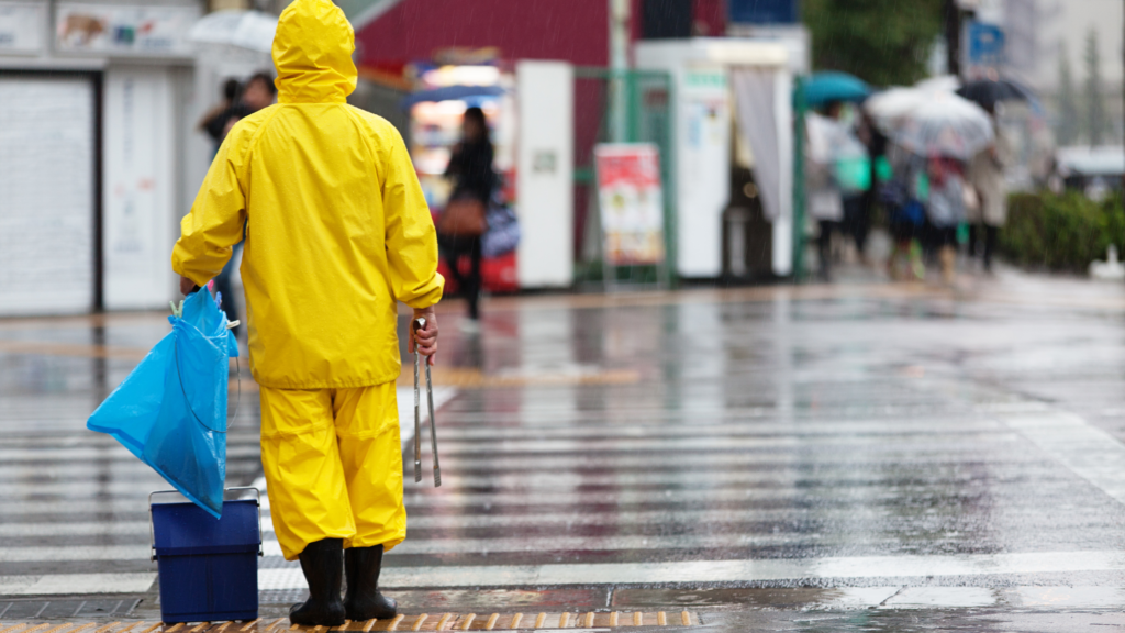 A man walking the wet road amid Typhoon shanshan in japan