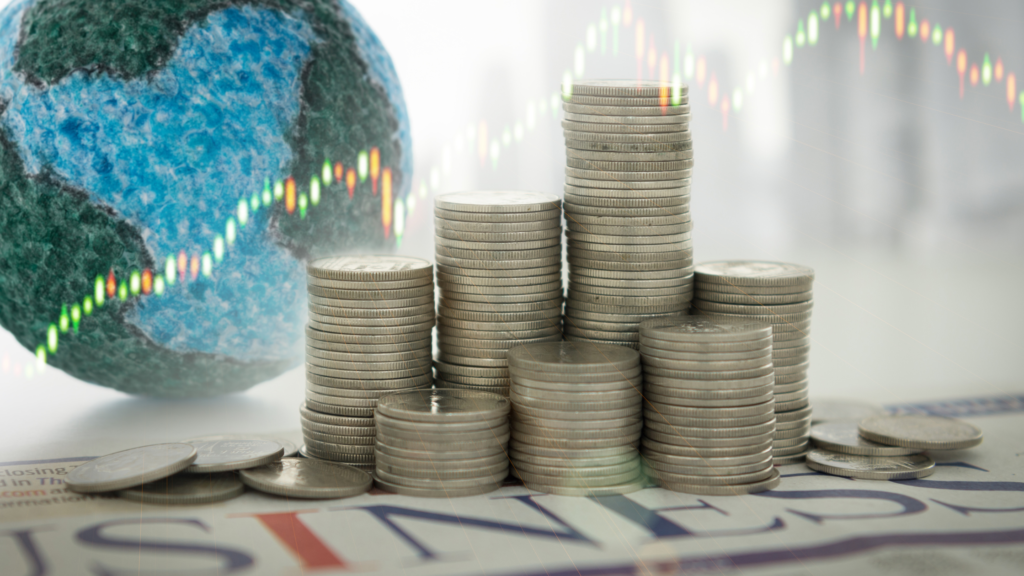 A stack of coins is prominently displayed in the foreground, symbolizing economic growth. In the background, a textured globe represents global environmental concerns. A financial graph overlays the image, indicating the intersection of economy and ecology.