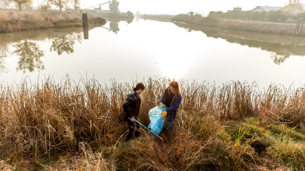 Community members working together to clean up a polluted river.