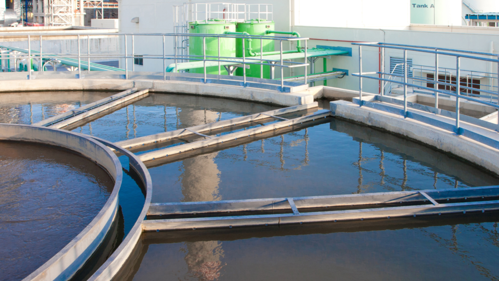 Water treatment plant with multiple tanks and pipes. A process entailing how to stop water pollution